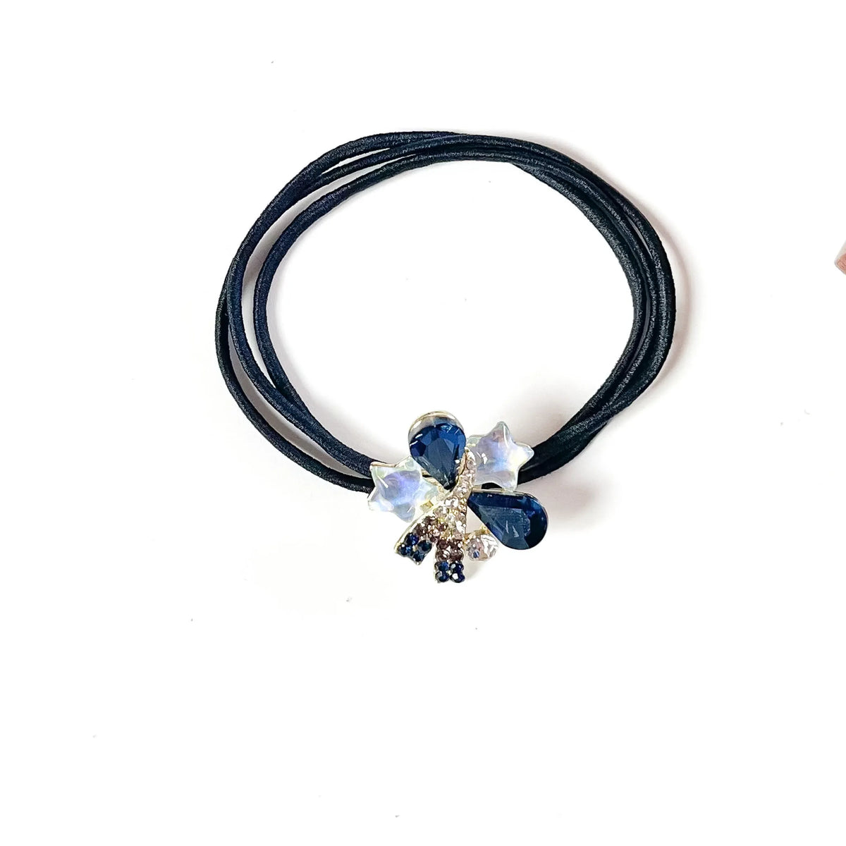 Sapphire blue fancy hair rubber band with navy teardrop crystals and white star charms, stylish ponytail holder