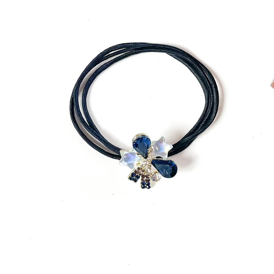 Sapphire blue fancy hair rubber band with navy teardrop crystals and white star charms, stylish ponytail holder