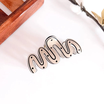 Ivory sculptural wave hair clip with ribbed design and crystalline finial, medium minimalist clip