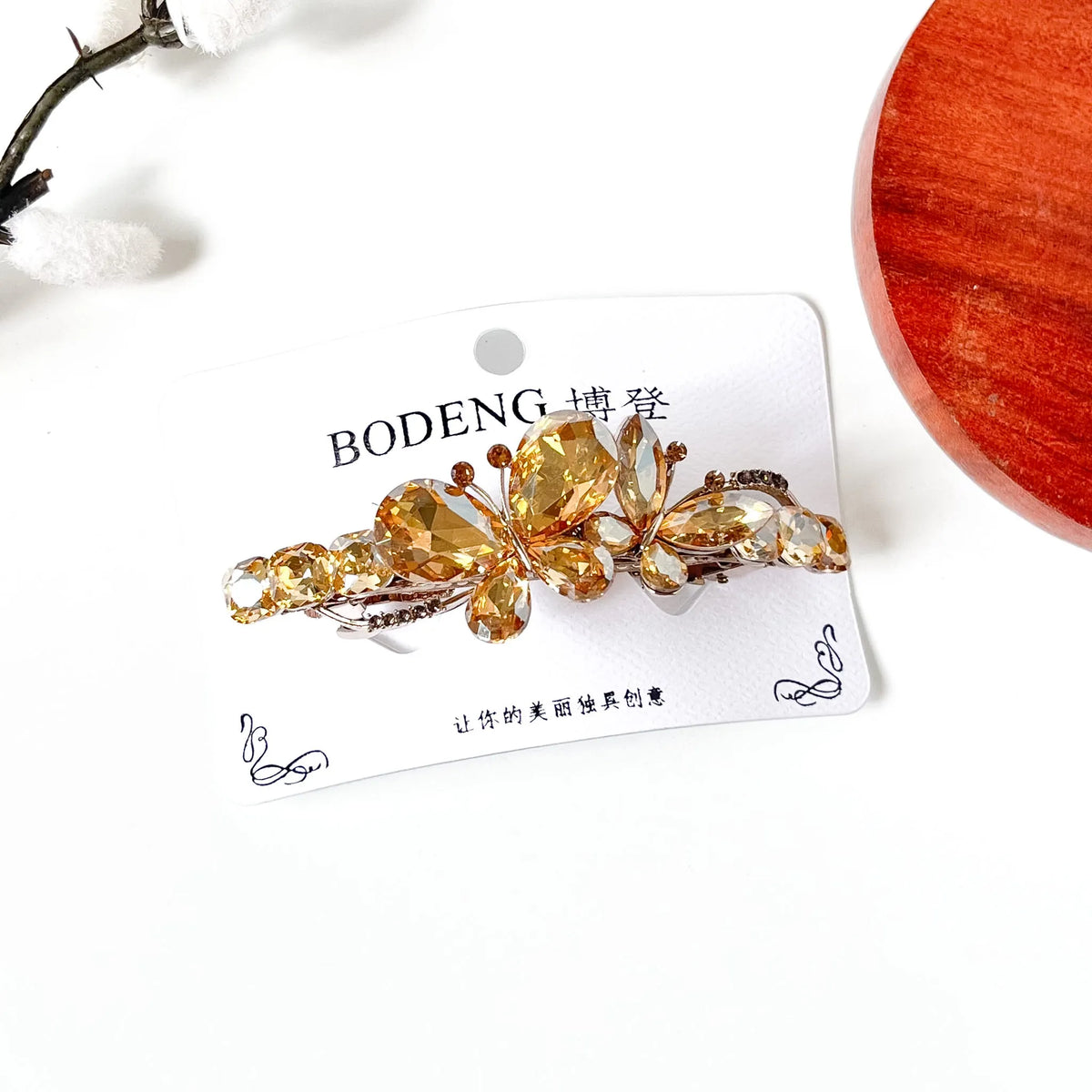 Champagne gold crystal butterfly barrette with cushion-cut stones, a jeweled hair clip for ladies