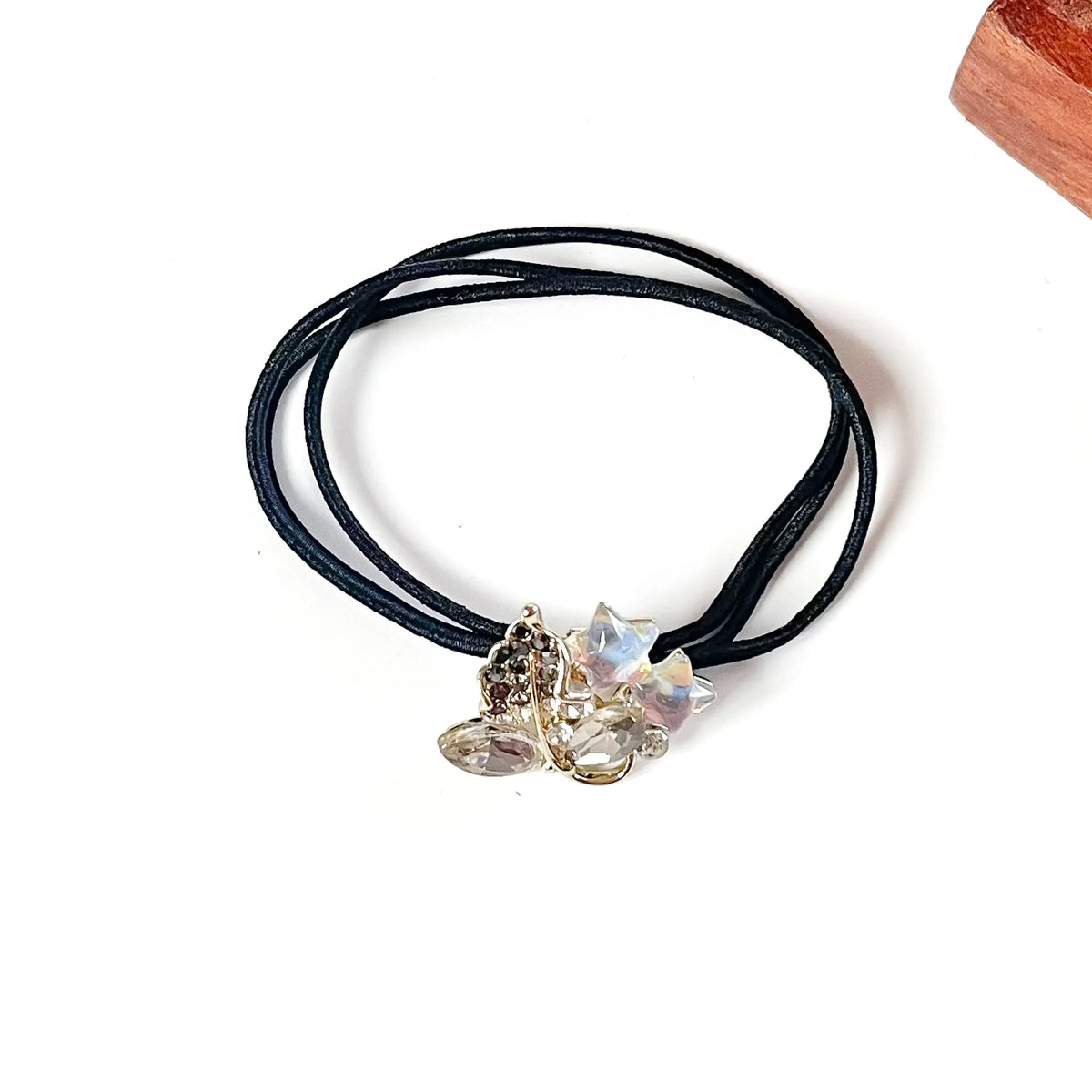 Slate grey jewelled hair tie with smoky crystals, grey rhinestone leaf and iridescent stars