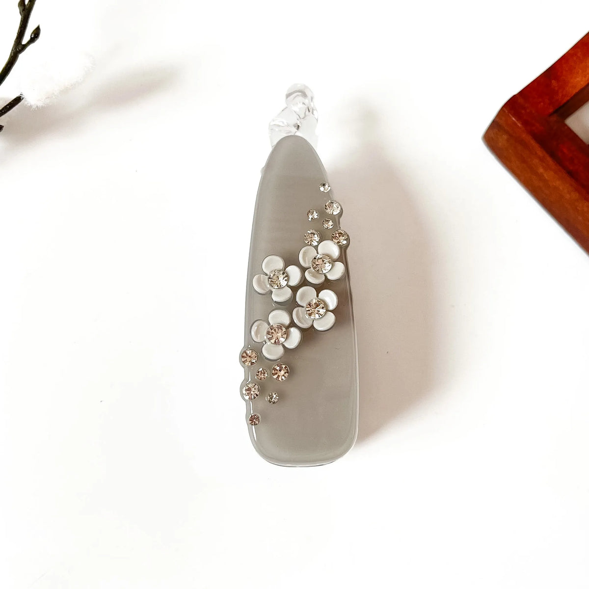 Slate grey large banana clip with silver gem rhinestones and white flower accent, perfect for curly hair