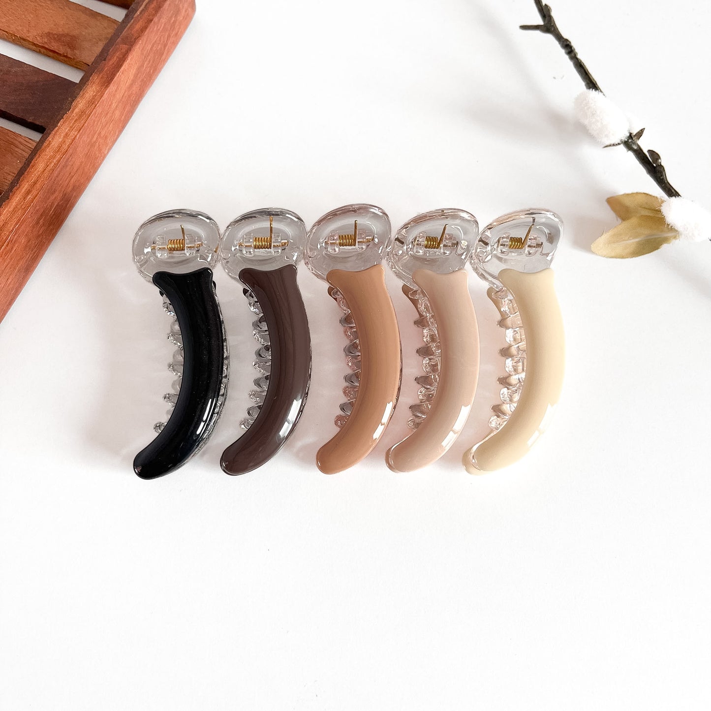 All 5 smooth gloss banana clips: black, burgundy, caramel, cream, ivory with polished finish