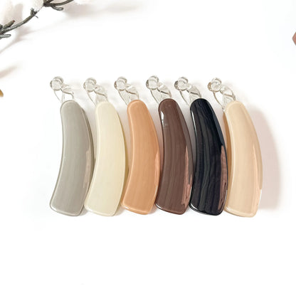 All 6 smooth gloss banana clips: black, burgundy, caramel, cream, ivory with polished finish