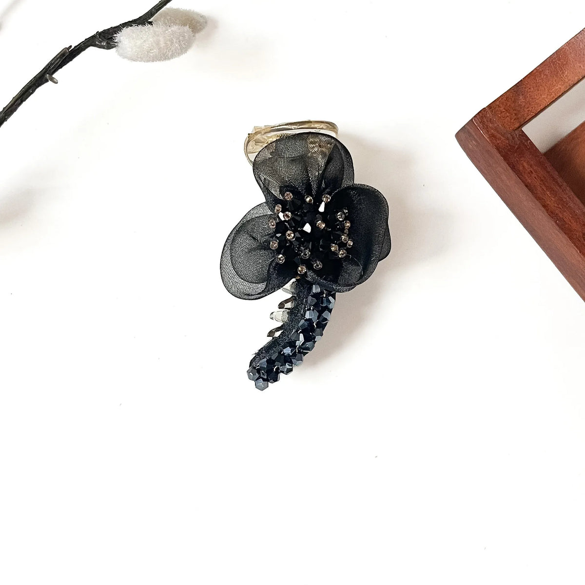 Starburst Bloom Banana Clip in onyx black, 8cm floral banana clutcher with black crystal stones