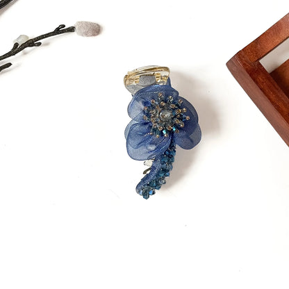Starburst Bloom Banana Clip in sapphire blue, 8cm floral banana clutcher with blue crystal stones
