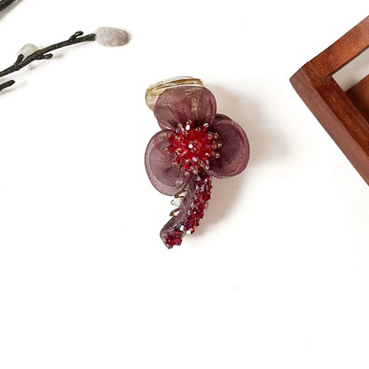Starburst Bloom Banana Clip in wine red, 8cm floral banana clutcher with ruby red crystal burst