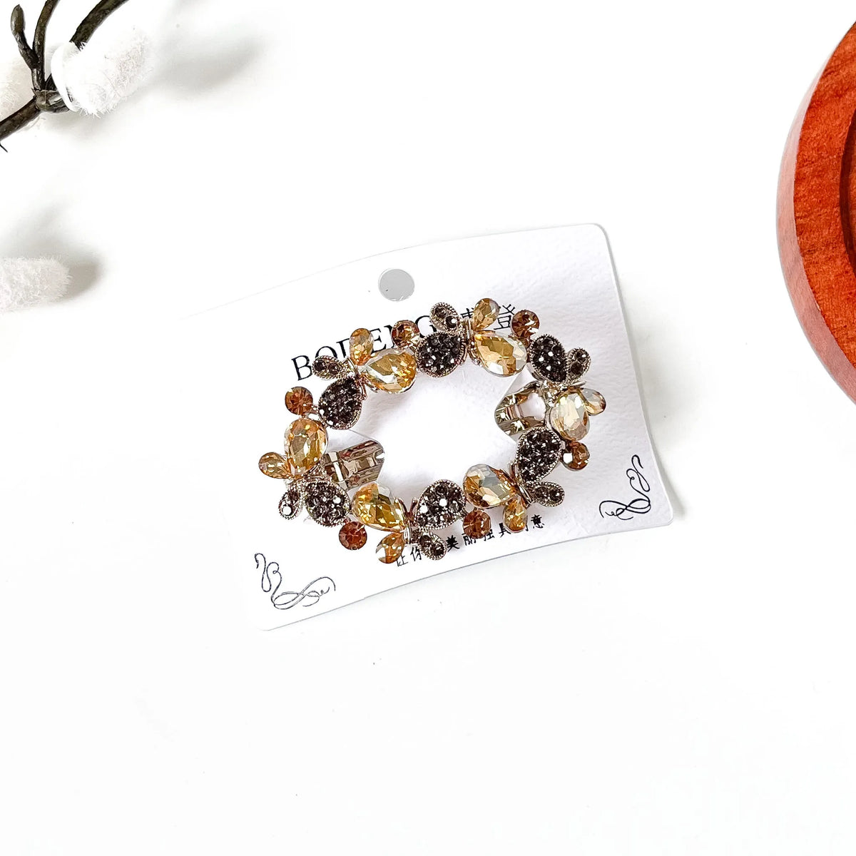 Champagne gold butterfly hair barrette with teardrop crystals, a fancy center clip with stones
