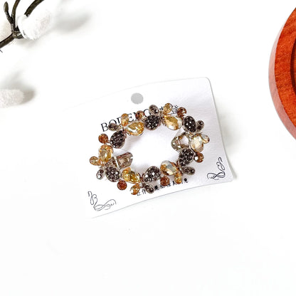 Champagne gold butterfly hair barrette with teardrop crystals, a fancy center clip with stones