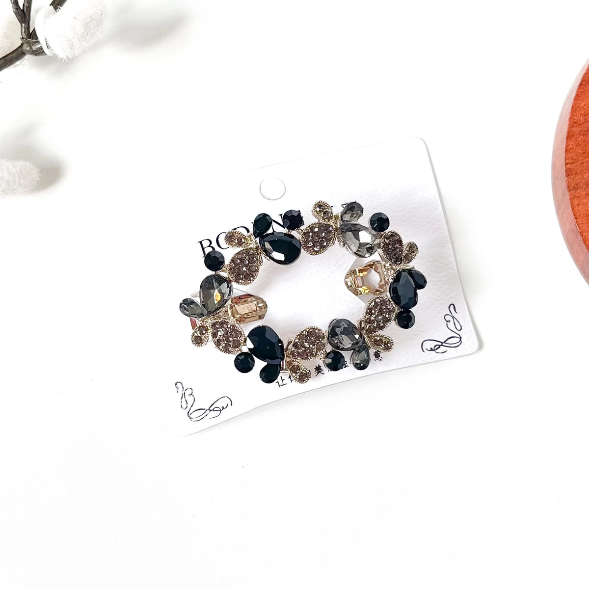 Noir black butterfly hair clip with black and smoky grey crystals, an elegant barrette for thick hair
