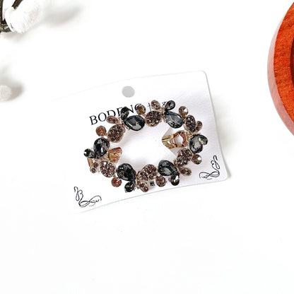 Slate grey crystal butterfly barrette with rhinestone wings, a stone center clip for buns