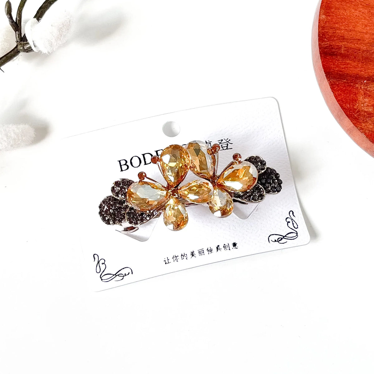 Champagne gold double butterfly hair barrette with teardrop crystals, a fancy hair clip with stones