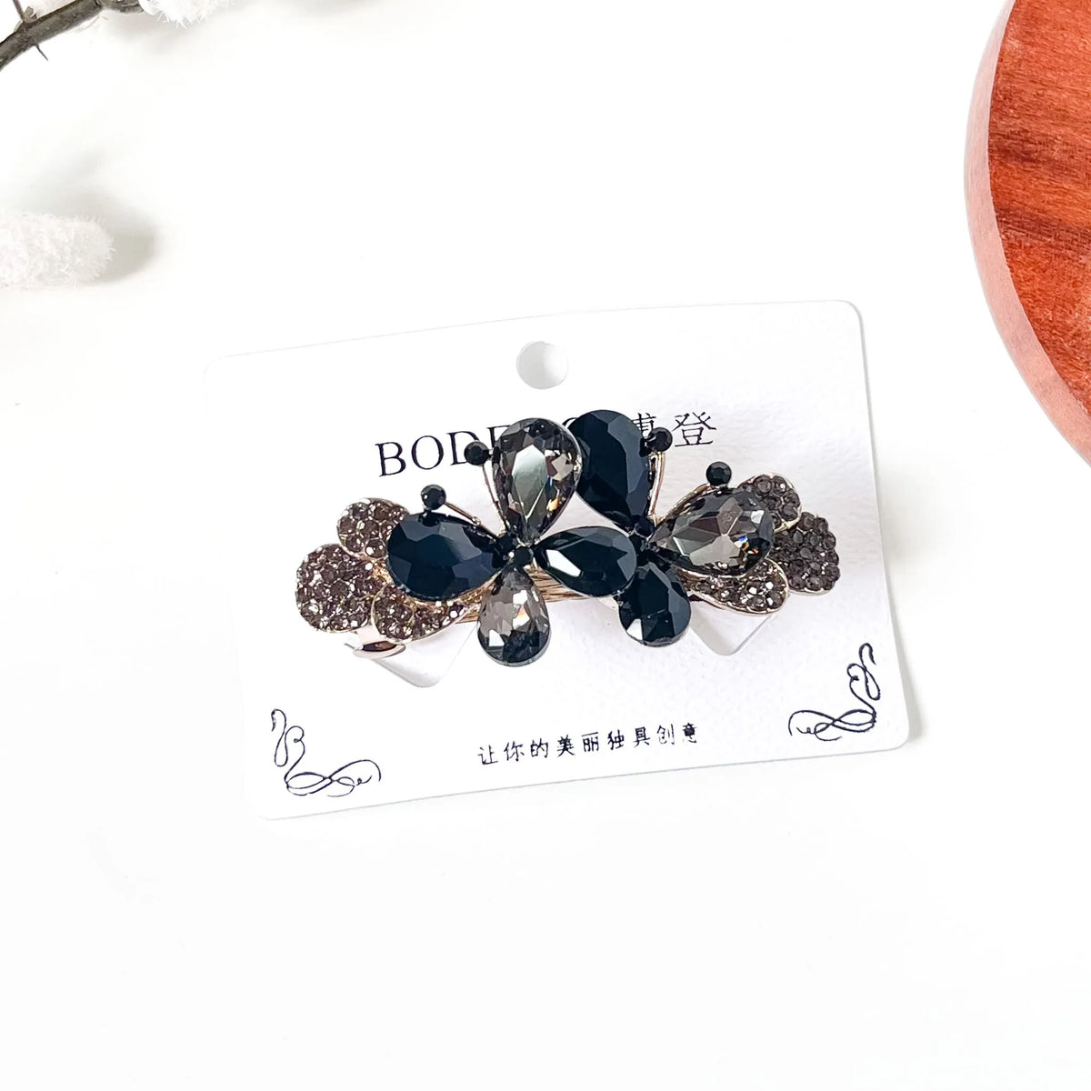 Noir black and smoky grey crystal butterfly barrette with rhinestone wings, an elegant hair clip for buns