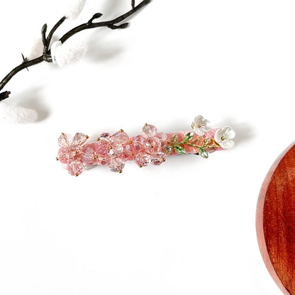 Blush pink crystal flower barrette on pink velvet with a gold leaf vine, a cute pink hair barrette