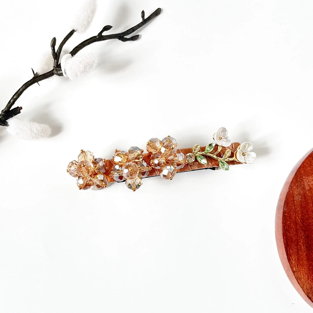 Champagne gold crystal bead flower barrette on caramel velvet, a Korean-style hair clip for buns