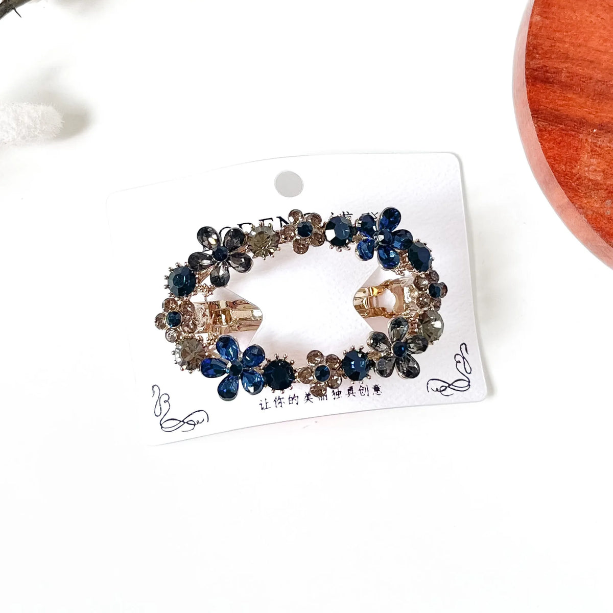 Sapphire navy blue and smoky grey crystal flower barrette, a fancy center clip with stones